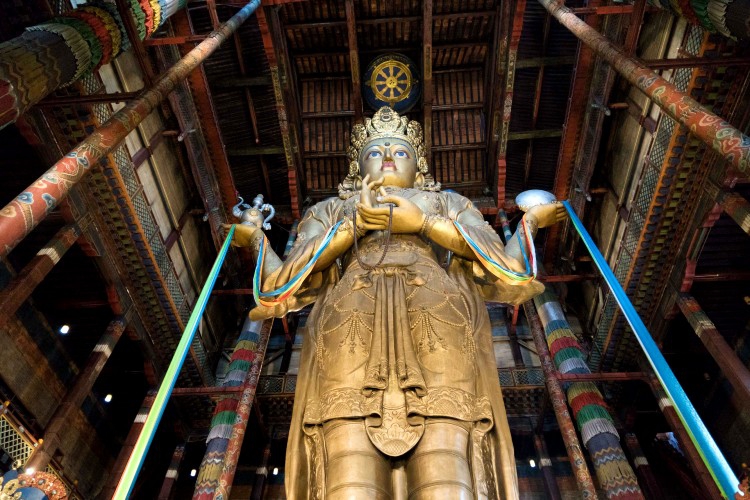 26.5 m high gilt statue of Migjid Janraiseg. Giant Buddha at Gandan Monastery