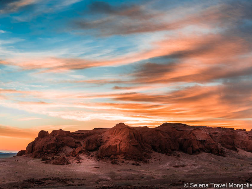 Sunset over the Flaming Cliffs at Bayanzag, famous for dinosaur fossil discoveries in Mongolia.